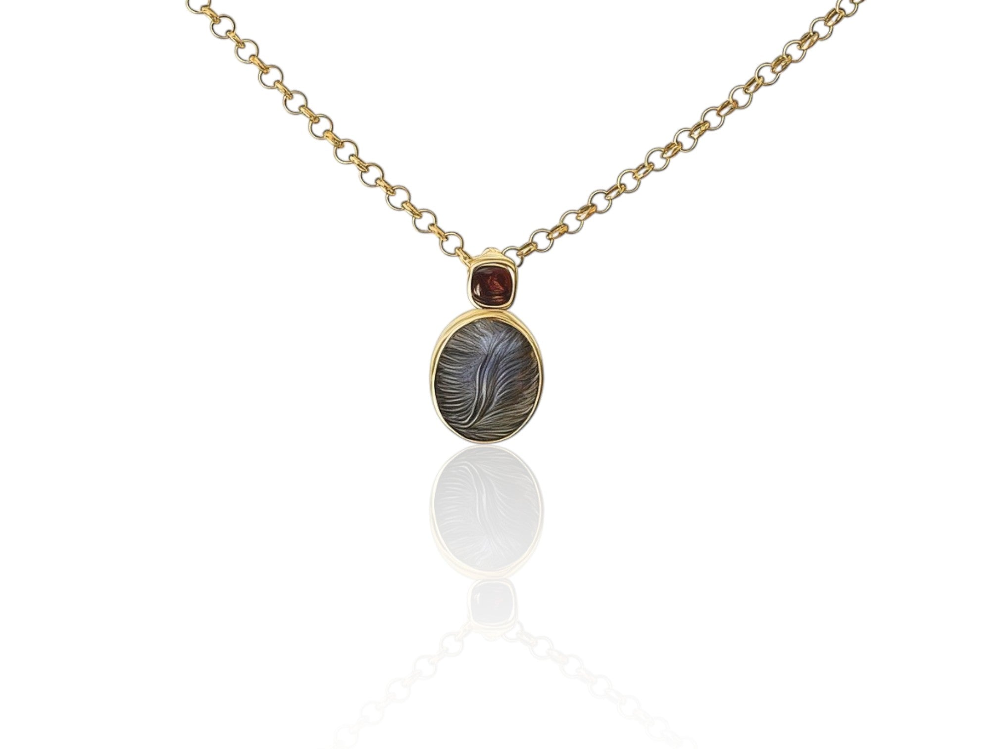 Petite Dickinsonia and garnet pendant